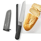 Serrated knife on a white cutting board with a loaf of bread