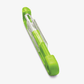 A green Sharple vegetable peeler with a safety cover and a visible stainless steel blade, designed for kitchen use.