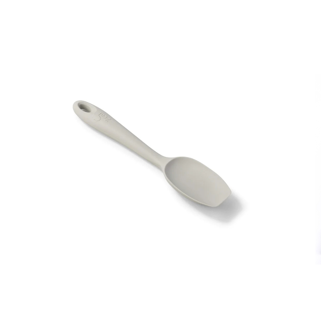 Meet your new kitchen essential—the Silicone Spoonula in Coastal Grey! This clever hybrid of a spoon and spatula is designed for ultimate versatility, making stirring, scraping, mixing, and baking a breeze. 