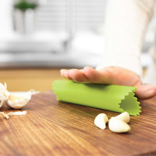 Say goodbye to garlicky fingers with this clever little Garlic Roller! Made from durable, flexible silicone, it effortlessly removes the outer skin from garlic cloves—just pop one inside, press, and roll. The premium design keeps your hands odor-free while making peeling quick and mess-free. 