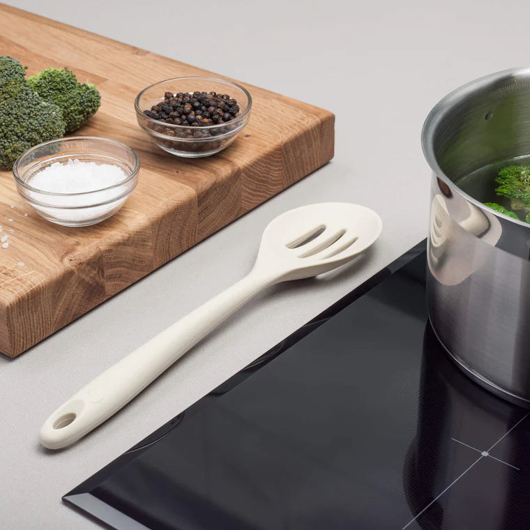 The Silicone Slotted Spoon in Coastal Cream is the ultimate multitasker for your kitchen! Perfect for stirring, straining, and serving, its sculpted head makes cooking effortless. The sturdy nylon core is wrapped in high-quality, non-scratch silicone, keeping your cookware safe while handling high heat up to 482ºF.