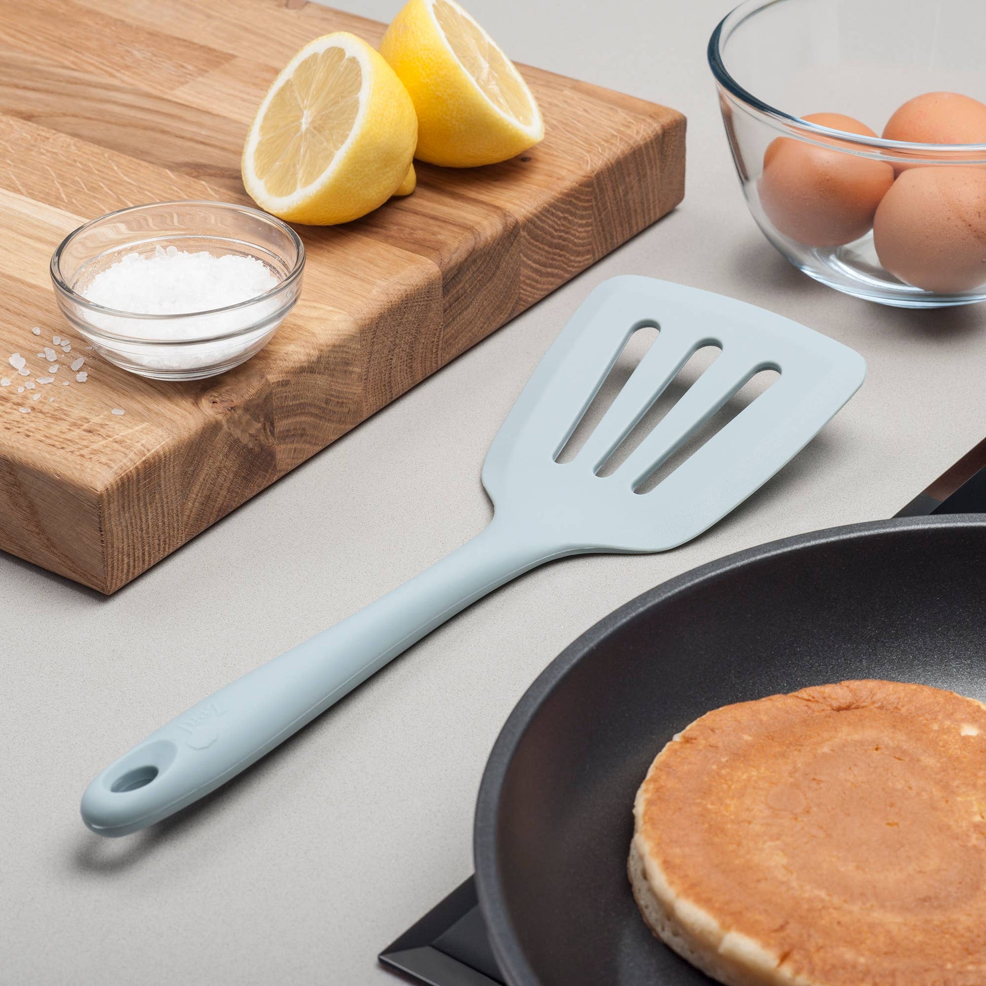 Flip, lift, and serve with ease using the Zeal Silicone Slotted Turner in Coastal Blue! Designed with a flexible steel core and a wide, tapered head, this turner makes handling delicate foods—like omelets, crepes, and flaky fish—a breeze.