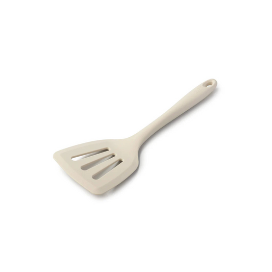 Flip, lift, and serve with ease using the Zeal Silicone Slotted Turner in Coastal Green! Designed with a flexible steel core and a wide, tapered head, this turner makes handling delicate foods—like omelets, crepes, and flaky fish—a breeze. 