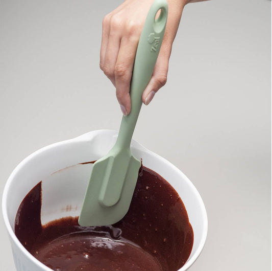 The 10" Coastal Green Silicone Spatula by Zeal is your go-to kitchen sidekick for stirring, scraping, mixing, and baking with ease. Designed with an ergonomic handle and a handy hanging loop for effortless storage, this spatula features a flexible yet durable non-scratch silicone head that’s safe for all non-stick surfaces.