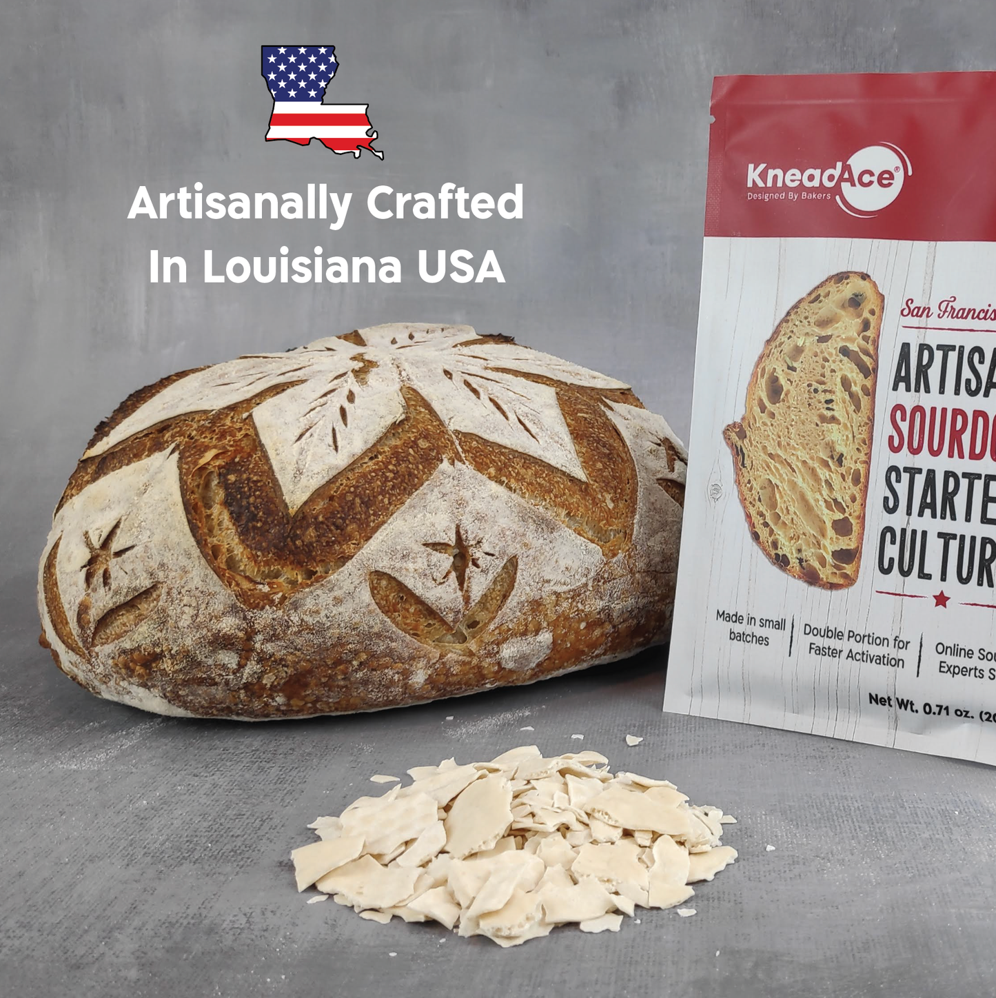 Artisanal bread loaf with Knead Ice sourdough starter culture packaging on a gray background