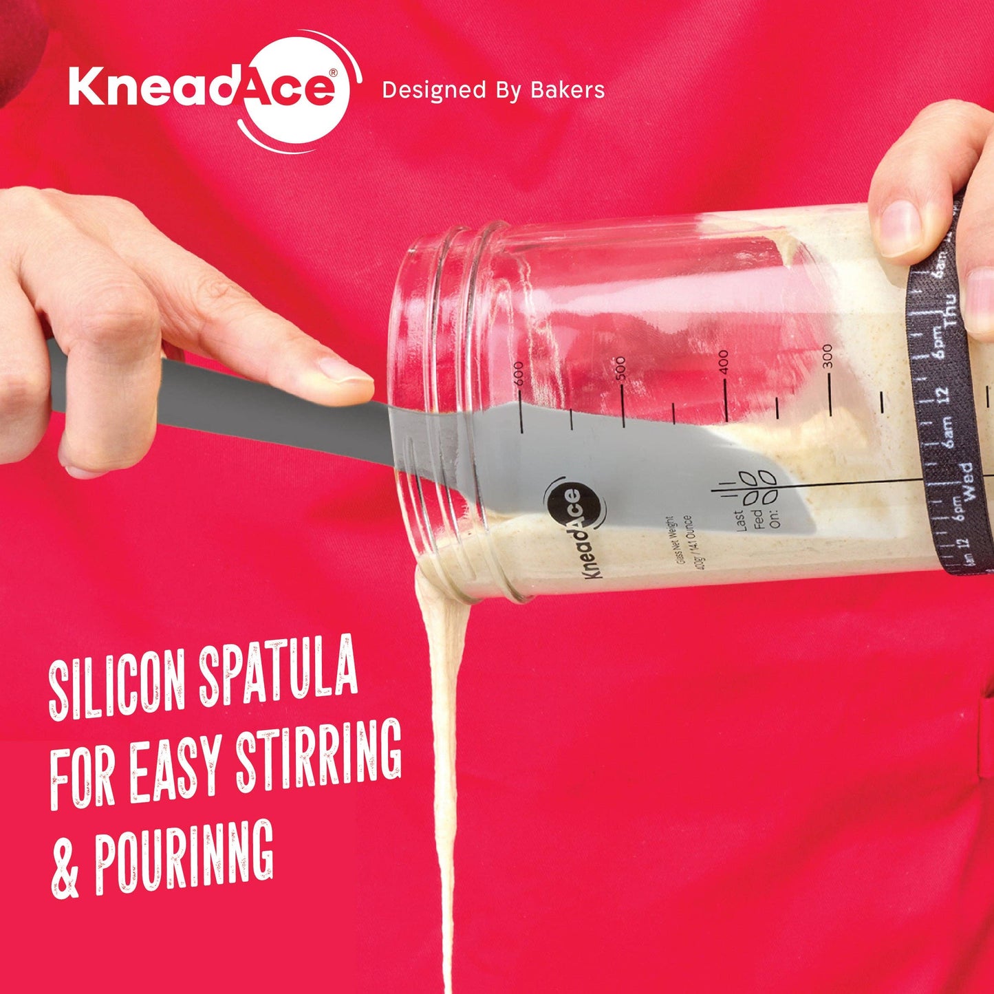 KneadAce silicone spatula with measuring scale against a red background
