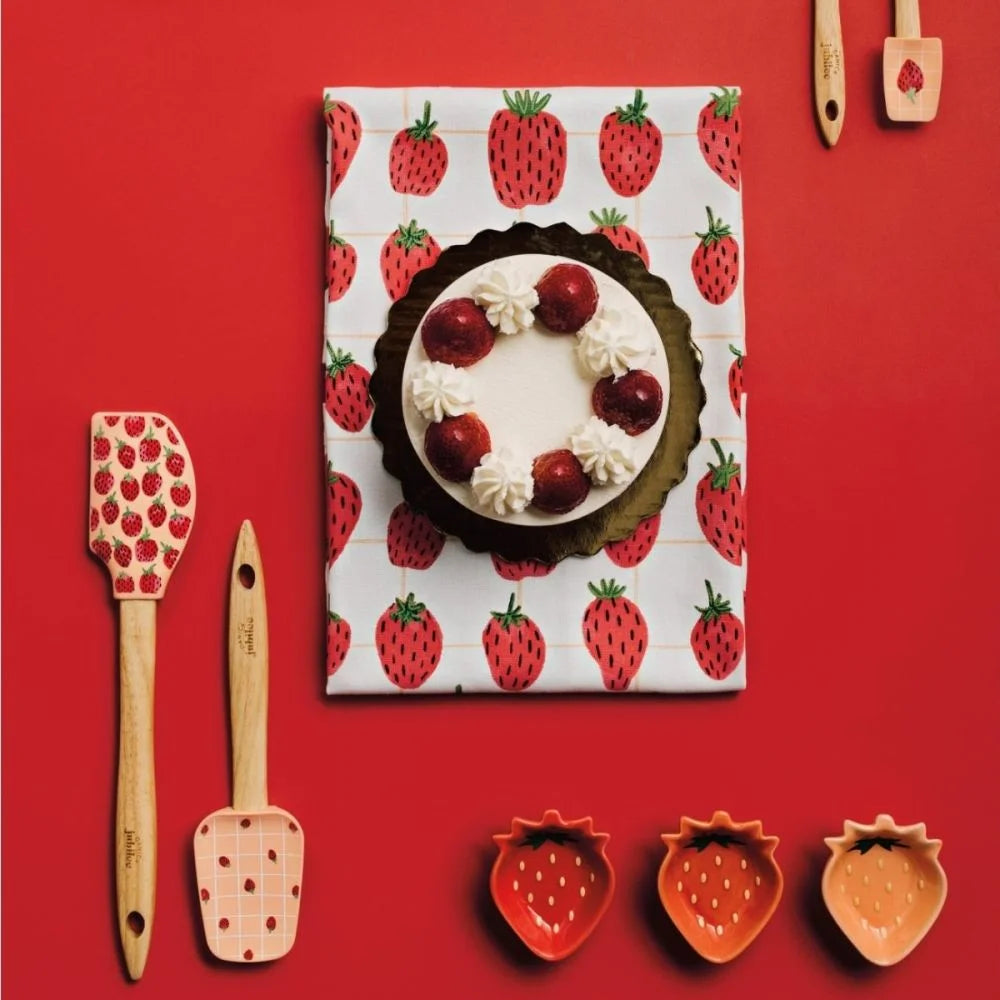 Berry Sweet Spoonulas! These adorable tools feature a rubberwood handle and heat-resistant silicone heads, perfect for mixing, scraping, and serving. With a charming pink checkered design, the larger spoonula boasts tiny strawberries, while the smaller one showcases a single, oversized berry.