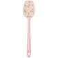 Pink spatula with floral design on a white background