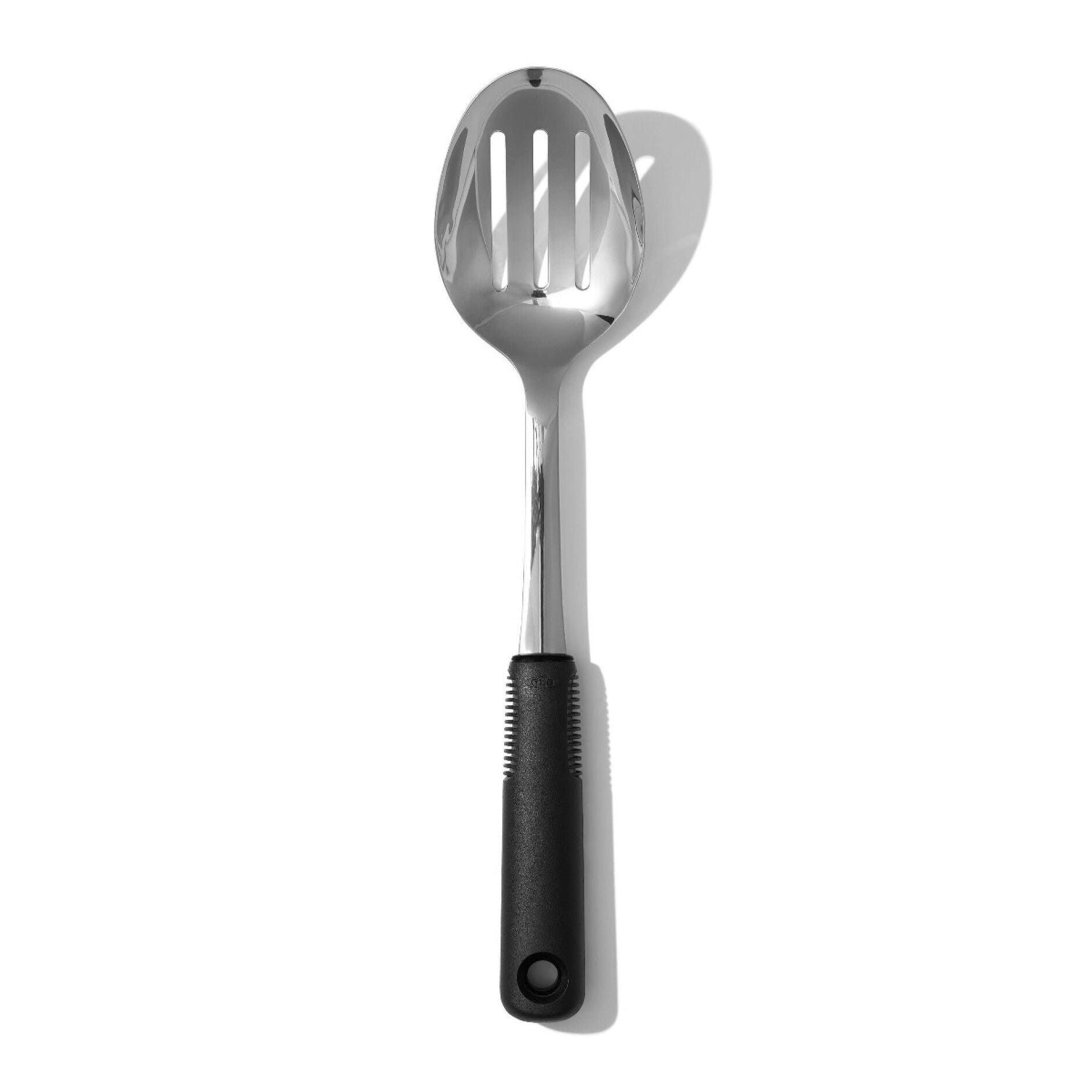 The clever slots work like tiny waterslides for excess liquid while keeping your food firmly on board. The cushy non-slip handle feels like a warm hug for your hand during kitchen adventures, preventing any mid-scoop slippage disasters.