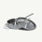 A stainless steel sauté pan with a lid and stay-cool handle, on a white background.