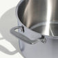 A silver stainless clad stock pot with lid, featuring two handles and a fitted lid, on a white background.