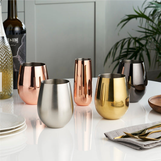 Sip fine wine and rich spirits alike from stainless stemless tumblers, each one polished and rounded to fit perfectly in the curve of your palm as it collects and intensifies the aromas of your drink. A heady toast to comfort and elegance that's sure to make every gathering feel that much classier!