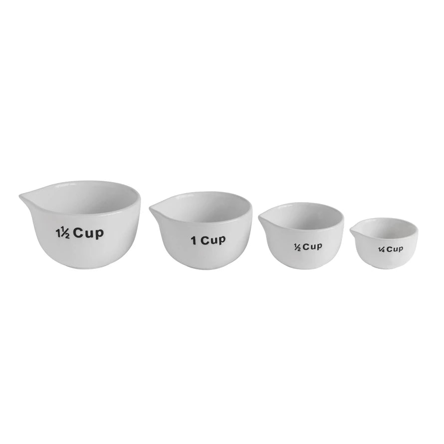 Enhance your baking experience with this charming Set of Decorative Stoneware Measuring Cups, designed for both functionality and style. Each cup is clearly labeled with large, easy-to-read lettering on the exterior, ensuring precise measurements every time.