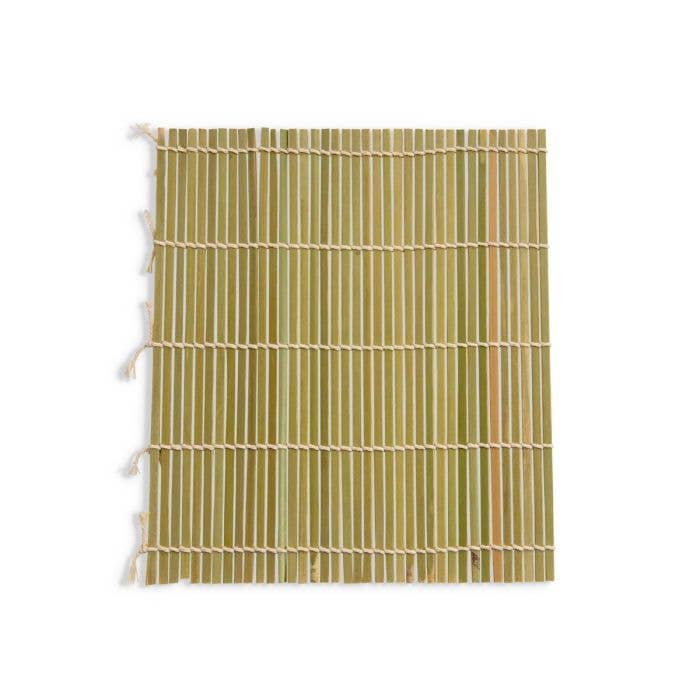 Bamboo mat with green and beige stripes on a white background
