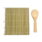 Bamboo mat with tassels and wooden spoon on a white background