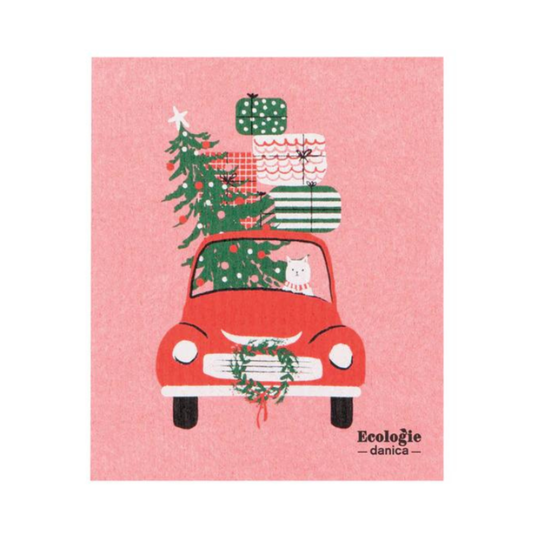 Red car with Christmas tree and gifts on a pink background, featuring the brand 'Ecoélogie danèsa'.