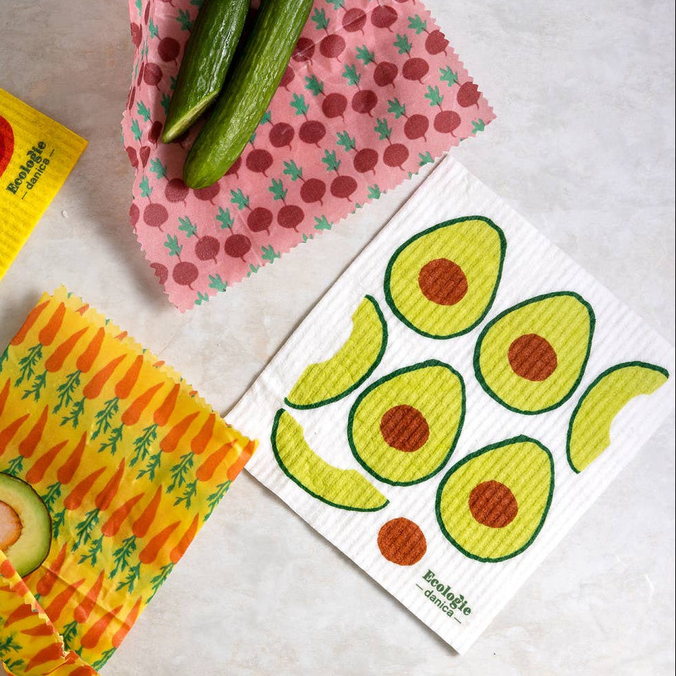 Set of reusable food wraps with fruit and vegetable designs on a neutral background