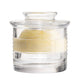 Clear glass container with a block of butter inside on a white background
