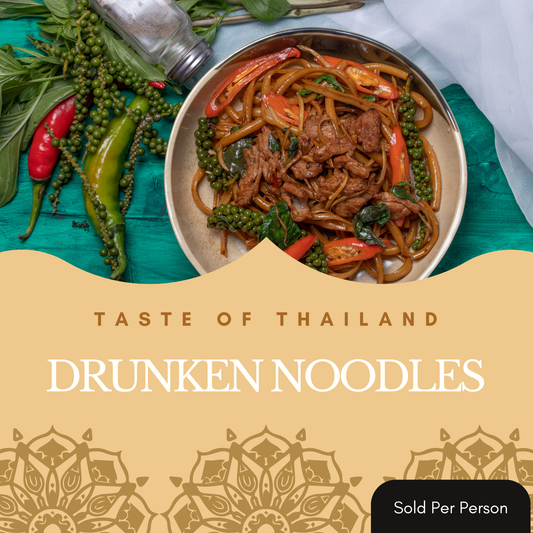 A bowl of Thai drunken noodles filled with beef, red peppers, green peppers, and broccoli, presented on a teal wooden surface with whole red and green chilies, peppercorns, and a pepper shaker. A beige graphic overlay at the bottom reads 'TASTE OF THAILAND DRUNKEN NOODLES' with a 'Sold Per Person' badge in the corner.