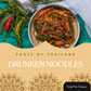 A bowl of Thai drunken noodles filled with beef, red peppers, green peppers, and broccoli, presented on a teal wooden surface with whole red and green chilies, peppercorns, and a pepper shaker. A beige graphic overlay at the bottom reads 'TASTE OF THAILAND DRUNKEN NOODLES' with a 'Sold Per Person' badge in the corner.