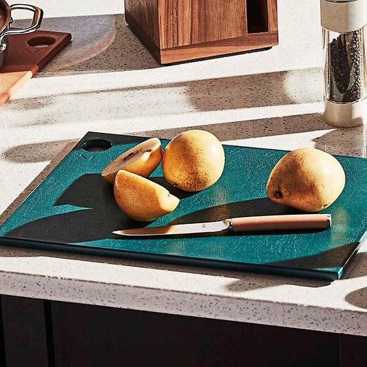 Everything to love, and nothing to waste. These colorful BPA-free cutting boards are made entirely of kitchen plastic scraps and renewable sugarcane. One small step for sustainability, one giant leap for kitchen goods. 