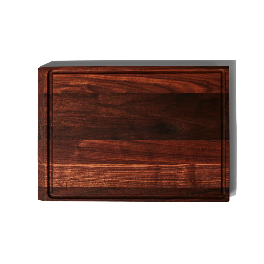 A cutting board you’ll want to display. Our elegant, hefty board is made with FSC-certified wood, and is thoughtfully built for both serious prep and simple serving. With a smooth side and a grooved-side, it’s ideal for cutting a juicy watermelon, carving a steak, or plating charcuterie.