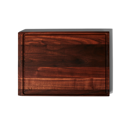 A cutting board you’ll want to display. Our elegant, hefty board is made with FSC-certified wood, and is thoughtfully built for both serious prep and simple serving. With a smooth side and a grooved-side, it’s ideal for cutting a juicy watermelon, carving a steak, or plating charcuterie.