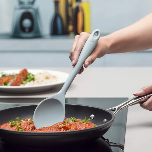 Stir, mix, and cook in style with the Silicone Spoon in Coastal Blue! This modern take on the classic wooden spoon features a solid stainless steel core wrapped in high-grade, BPA-free silicone for a warm, comfortable grip.