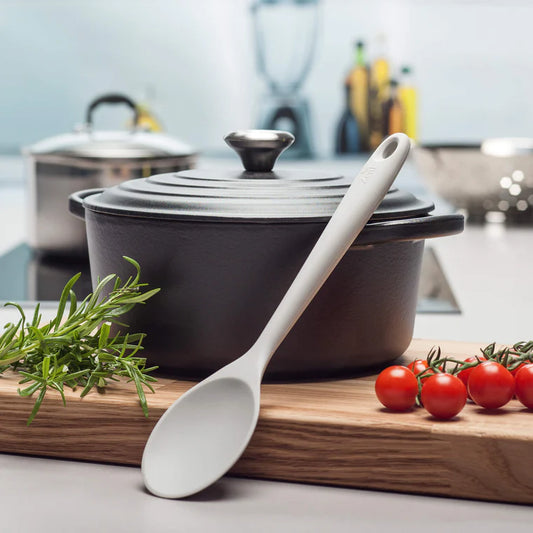 Stir, mix, and cook in style with the Silicone Spoon in Coastal Grey! This modern take on the classic wooden spoon features a solid stainless steel core wrapped in high-grade, BPA-free silicone for a warm, comfortable grip.