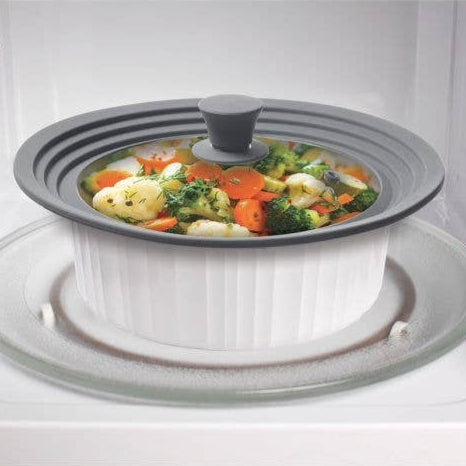 White microwaveable bowl with vegetables inside on a white background