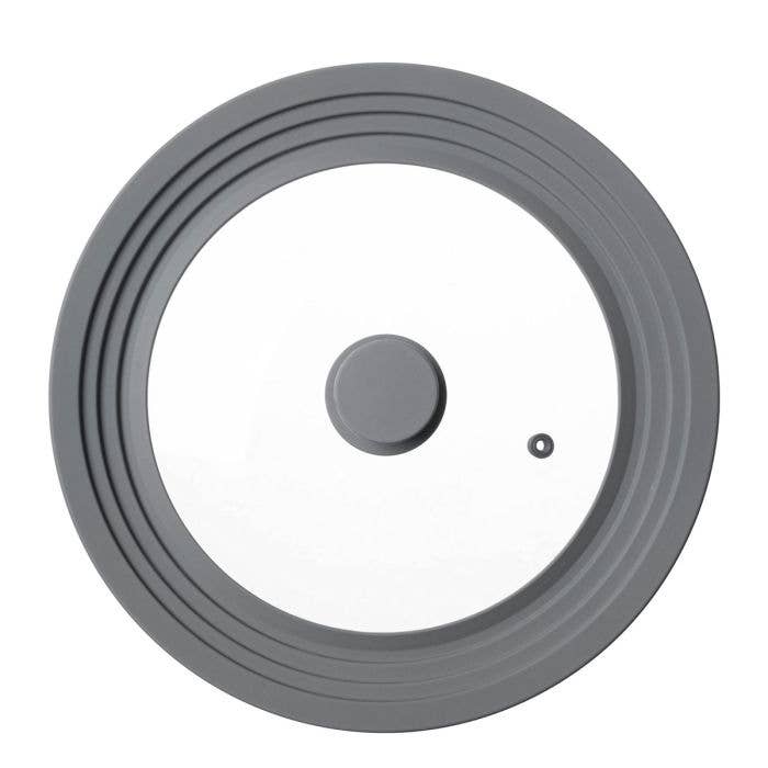 Gray rubber wheel with a smaller gray wheel inside on a white background