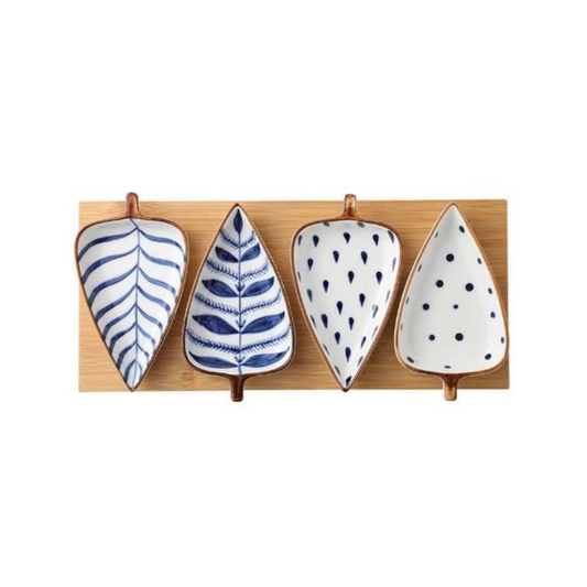 Elevate your dining experience with the Leaf Shape Ceramic Bowl Set. This set includes four exquisite white ceramic leaf-shaped dishes, each adorned with a unique blue design. Accompanied by a stylish bamboo tray, this set combines functionality with elegance. Crafted with high-quality materials, these bowls are heat resistant and top-rack dishwasher safe, ensuring effortless cleaning and durability