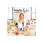 Book cover of 'Made by Lia' with a woman in a kitchen setting