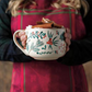 Winterberry Oversized Latte Mug being held with holiday drink