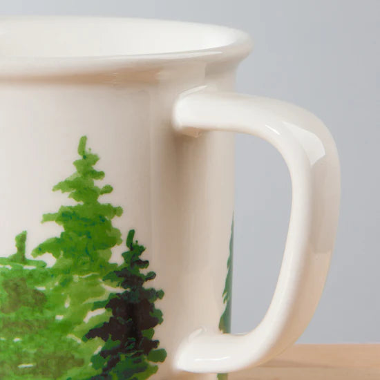 Woods Heritage Mug! Crafted from durable stoneware and styled with a classic enamel-inspired forest design