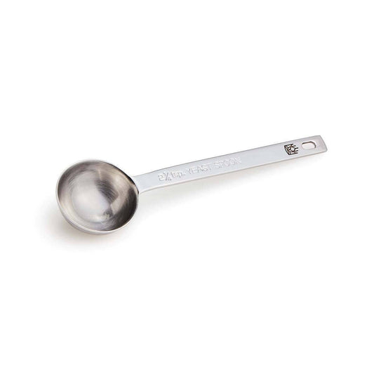 Stainless steel measuring spoon on a white background