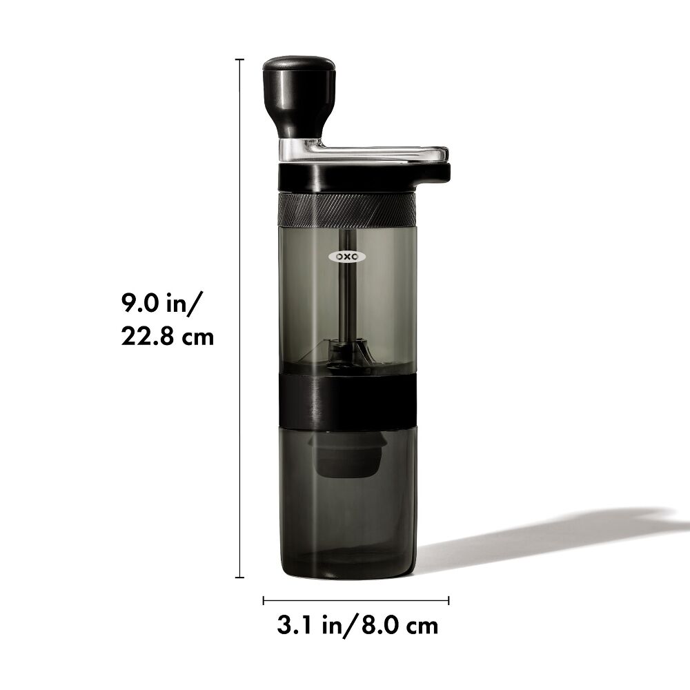 Black coffee grinder with measurements on a white background