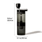 Black coffee grinder with measurements on a white background