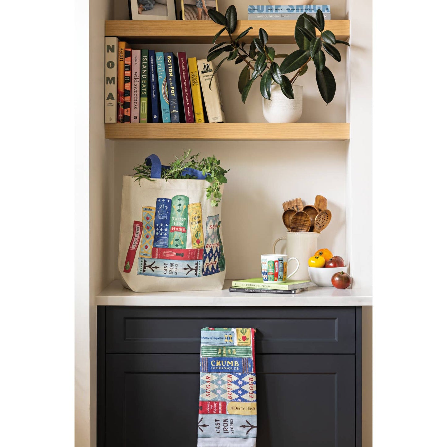 Bookshelf with books, a tote bag, and decorative items.