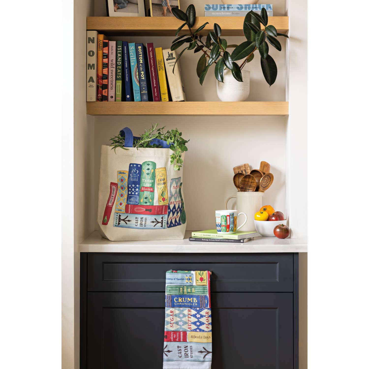 Bookshelf with books, a tote bag, and decorative items.