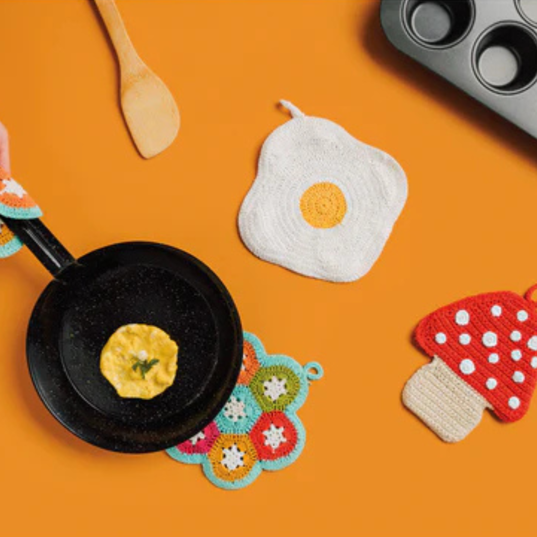 Add a playful touch to your kitchen with the Crochet Egg Trivet, a delightful blend of fun and function. Handmade with care, this 100% cotton trivet is inspired by our joyful collections, bringing warmth and personality to your cooking space. 