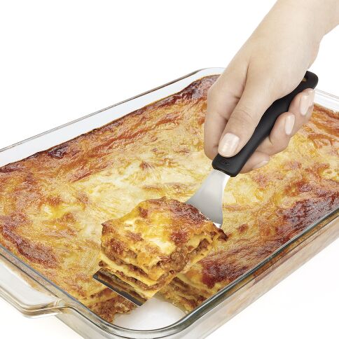 Introducing the kitchen magician you didn't know you needed—our Cut &amp; Serve Turner! This whimsical wonder boasts a razor-sharp front edge and flat, beveled head that glides through lasagna, brownies, and other treats like a hot knife through butter! 