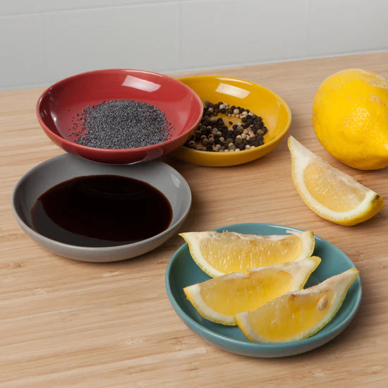 Add a pop of color to your table with the Canyon Dipping Dishes, a set of four stackable stoneware bowls in bold yellow, blue, grey, and red hues. Perfect for serving dips, nuts, candies, and more, these versatile dishes are both stylish and functional. 