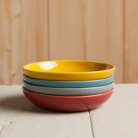 Add a pop of color to your table with the Canyon Dipping Dishes, a set of four stackable stoneware bowls in bold yellow, blue, grey, and red hues. Perfect for serving dips, nuts, candies, and more, these versatile dishes are both stylish and functional. 