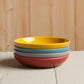 Add a pop of color to your table with the Canyon Dipping Dishes, a set of four stackable stoneware bowls in bold yellow, blue, grey, and red hues. Perfect for serving dips, nuts, candies, and more, these versatile dishes are both stylish and functional. 