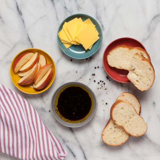 Add a pop of color to your table with the Canyon Dipping Dishes, a set of four stackable stoneware bowls in bold yellow, blue, grey, and red hues. Perfect for serving dips, nuts, candies, and more, these versatile dishes are both stylish and functional. 