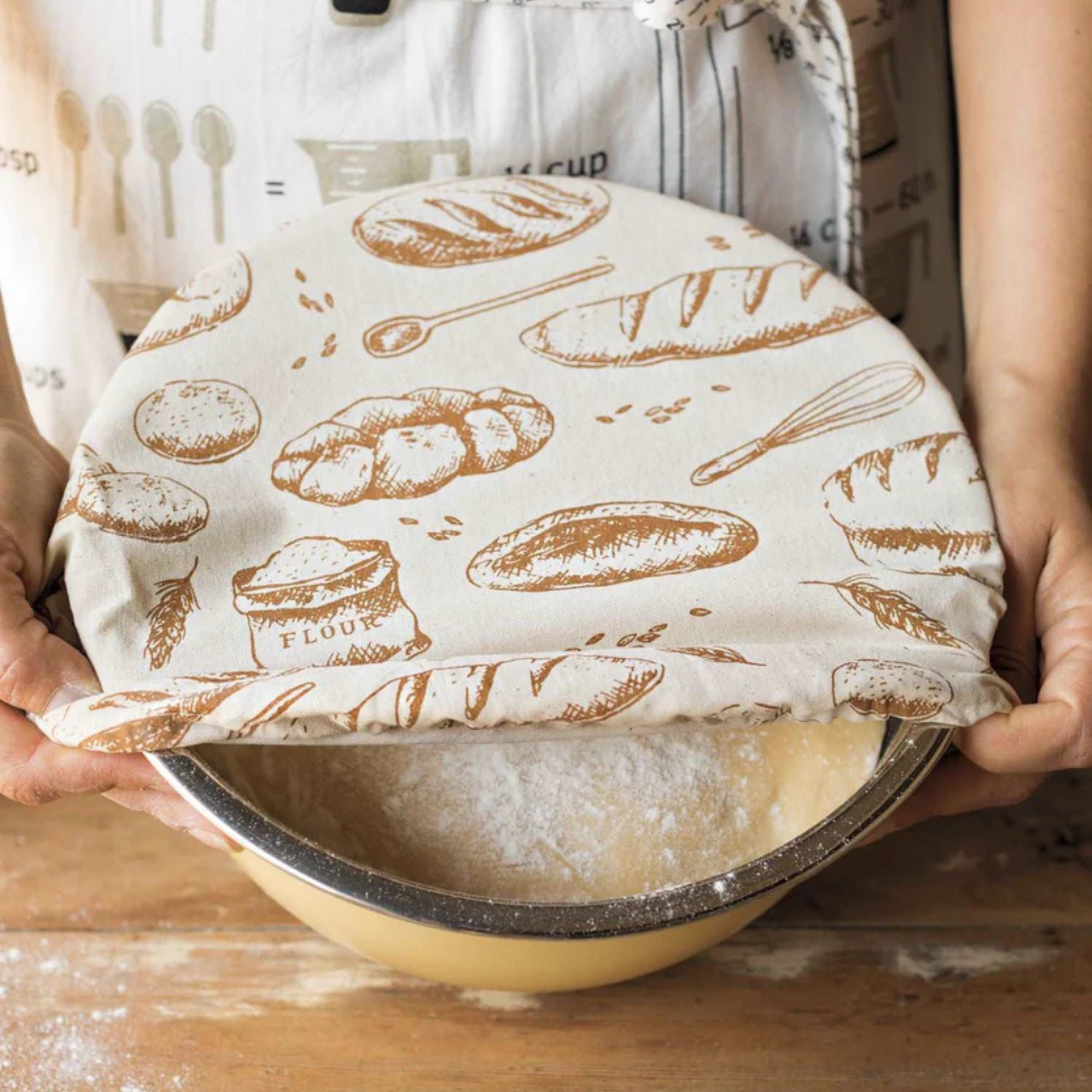 Give your homemade bread the perfect rise with the Fresh Baked Dough Riser Bowl Cover. Featuring a charming loaves of bread pattern, this reusable cover locks in moisture, shields dough from drafts, and protects it from dust, ensuring an ideal environment for proofing.