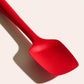Red spatula on a white background