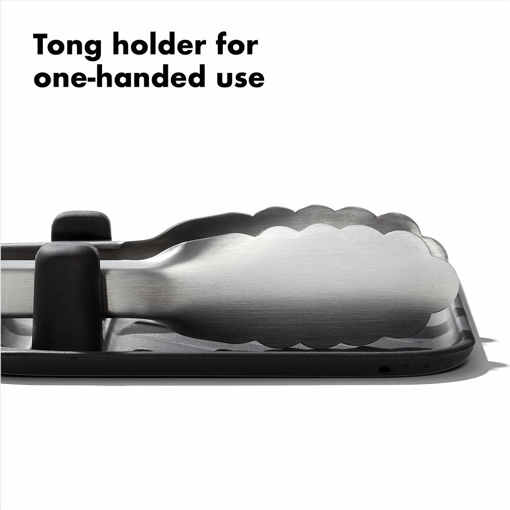 Tong holder with text 'Tong holder for one-handed use' on a white background