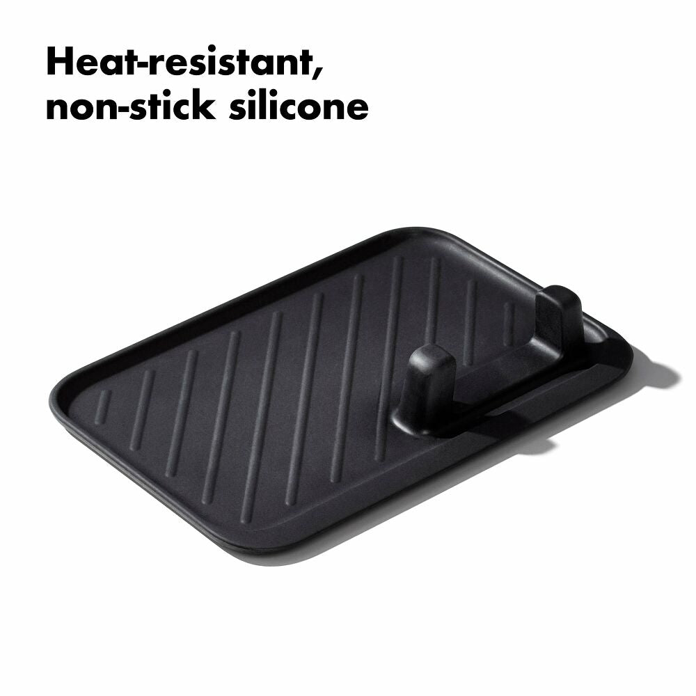 Black heat-resistant, non-stick silicone tray on a white background with text.